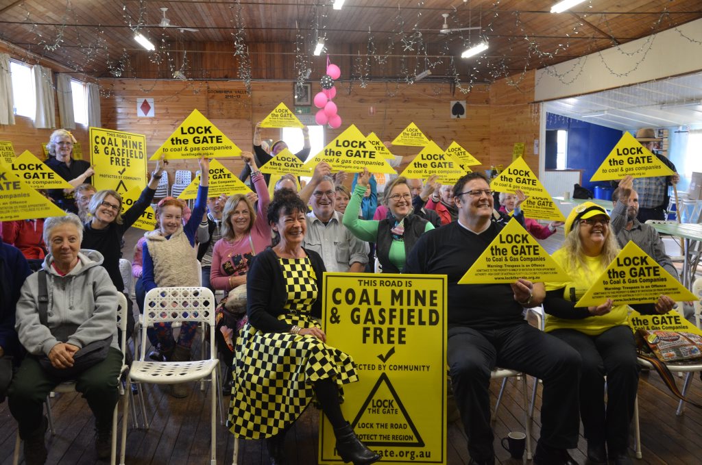 YELLOW ARMY: Lock The Gate representative Julie Devine and Senator Glenn Lazarus join the community to display the anti-mining message.